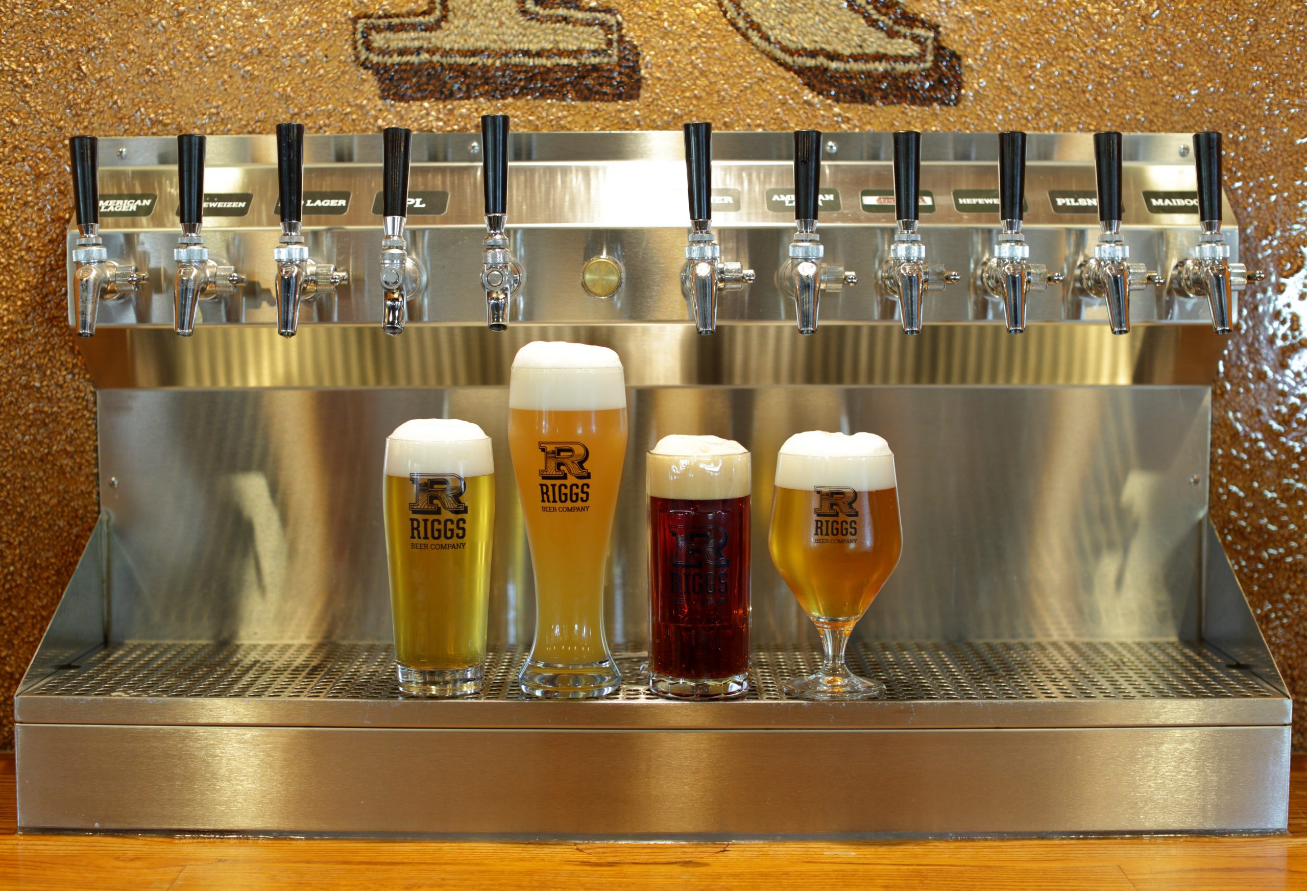 The Riggs taproom, with a view into the brewery